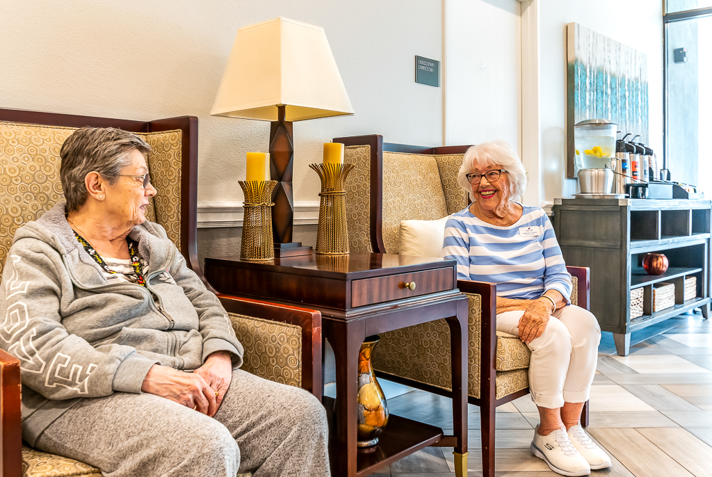 two women smiling at each other